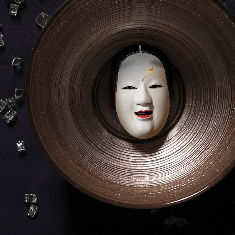 Mask on a plate with broken glass
