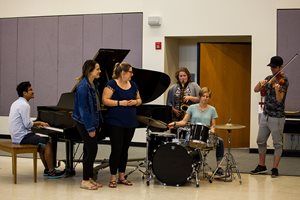 Students around a piano